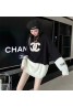 Chanel letter embroidered black and white paneled mid-length sweater